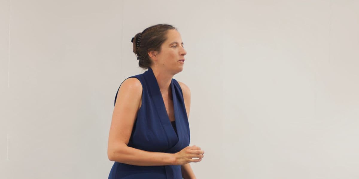 Melanie Suzanne Wilson presenting to an audience