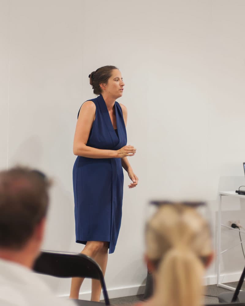 Melanie Suzanne Wilson speaking on stage
