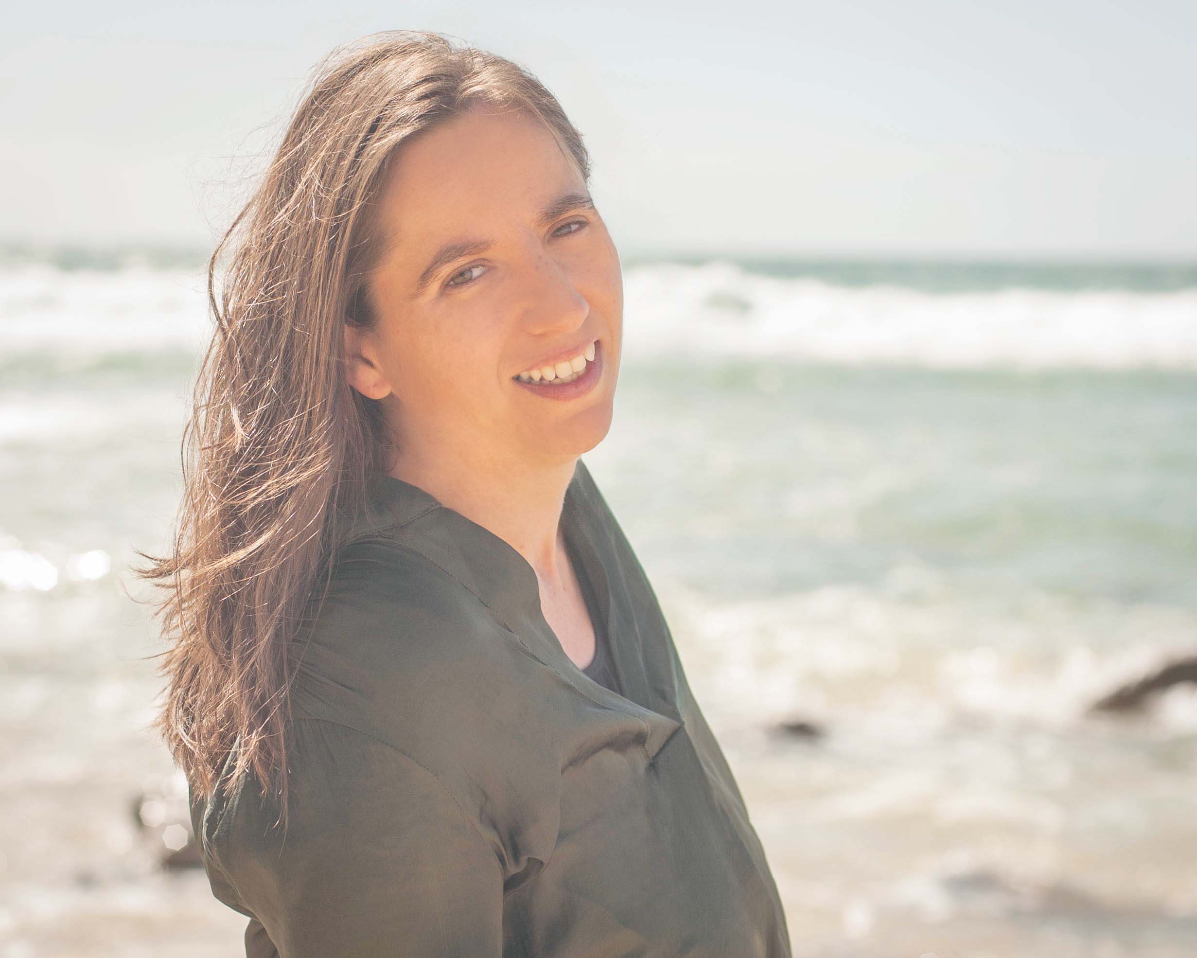 Melanie Suzanne Wilson turning at the beach